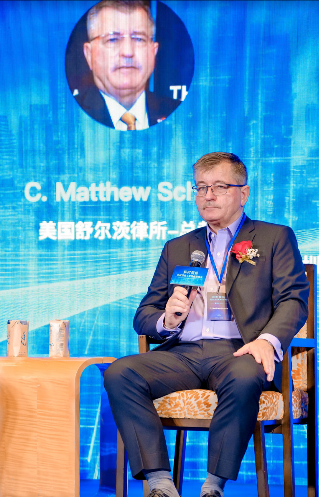 Attorney and CEO C. Matthew Schulz presenting at a 2024 EB5 conference in Shenzhen, China.